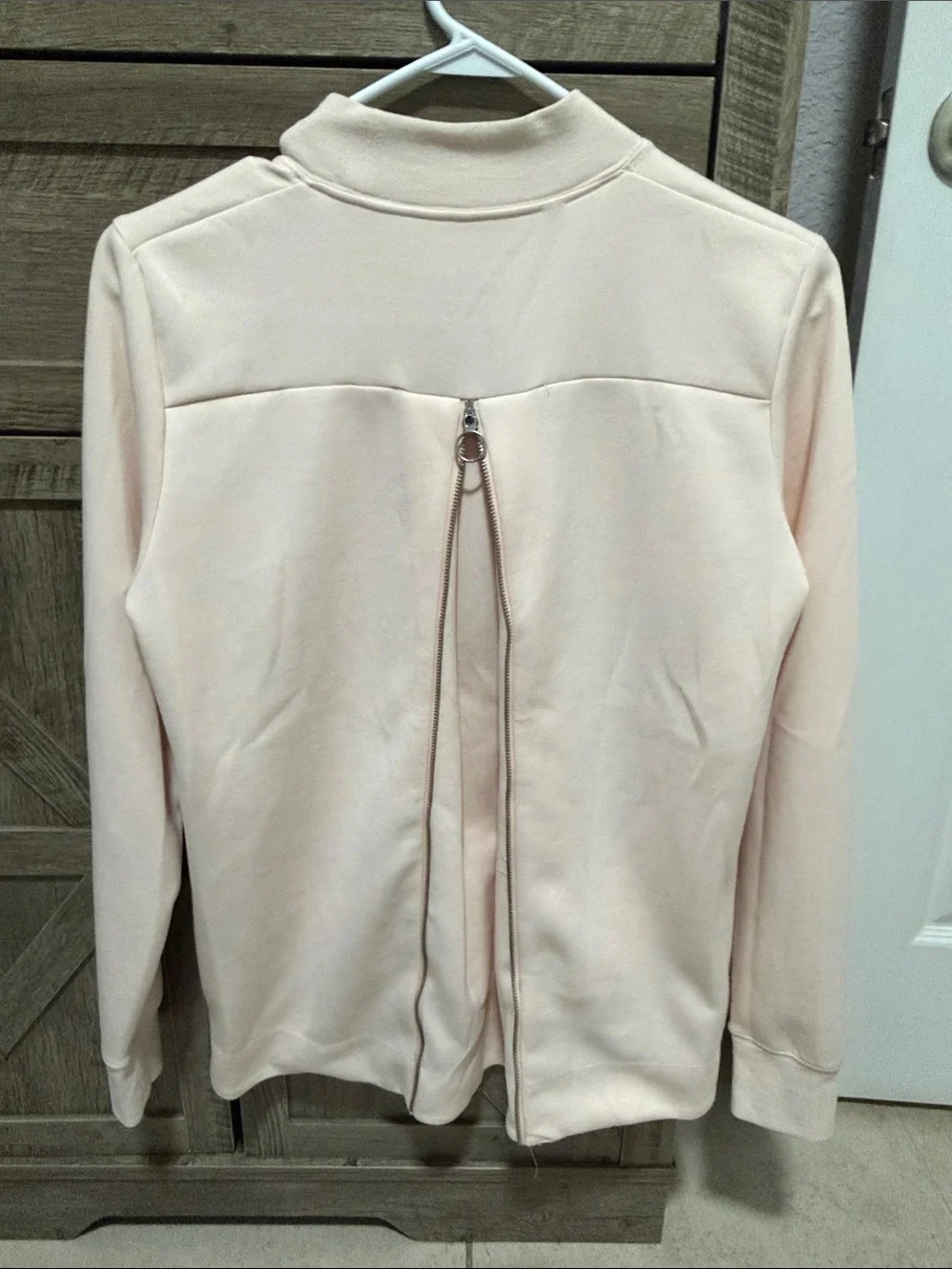 Nike Dri-FIT Loose Fit Top in Pale Pink